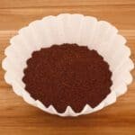 Coffee grounds, when mixed with water will attract cockroaches and without water, it will repel them.